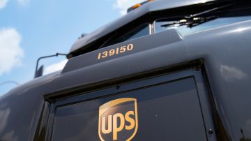 Delivery vehicles remain idle outside a UPS depot, Thursday, June 29, 2023, in New York. More than 340,000 unionized United Parcel Service employees, including drivers and warehouse workers, say they are prepared to strike if the company does not meet their demands before the end of the current contract on July 31. (AP Photo/John Minchillo)
