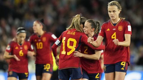 Spain's Olga Carmona, centre back to the camera, celebrates with teammates after scoring the opening goal during the final of Women's World Cup soccer between Spain and England at Stadium Australia in Sydney, Australia, Sunday, Aug. 20, 2023. (AP Photo/Rick Rycroft)