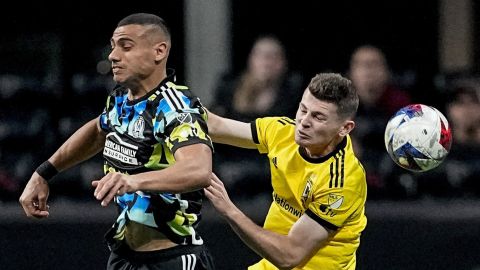 Atlanta United forward Giorgos Giakoumakis (7) and Columbus Crew midfielder Sean Zawadzki (25) vie for the ball during the first half of an MLS playoff soccer match, Tuesday, Nov. 7, 2023, in Atlanta. (AP Photo/Mike Stewart)