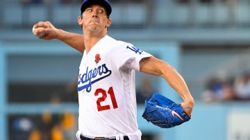 FILE - Los Angeles Dodgers starting pitcher Walker Buehler (21) throws against the Pittsburgh Pirates during the first inning of a baseball game Monday, May 30, 2022, in Los Angeles. Buehler found out Tommy John surgery is no longer a rarity but now routine.(AP Photo/John McCoy, File)