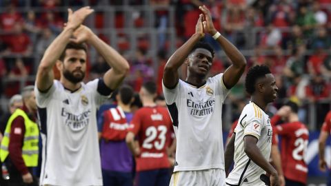 Real Madrid's Nacho, left, Vinicius Junior, background right, and Aurelien Tchouameni celebrate after the Spanish La Liga soccer match between Osasuna and Real Madrid at the El Sadar stadium in Pamplona, Spain, Saturday, March 16, 2023. (AP Photo/Alvaro Barrientos)