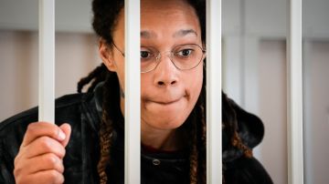 FILE - WNBA star and two-time Olympic gold medalist Brittney Griner speaks to her lawyers from inside a cage in a courtroom in Khimki, outside Moscow, Russia, on July 26, 2022. Arrests of Americans in Russia have become increasingly common as relations between Moscow and Washington sink to Cold War lows. Some have been exchanged for Russians held in the U.S., while for others, the prospects of being released in a swap are less clear. (AP Photo/Alexander Zemlianichenko, Pool, File)