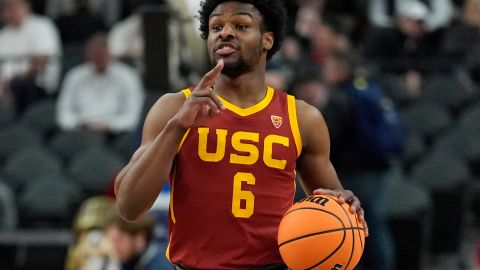 FILE - Southern California's Bronny James (6) drives up the court against Washington during the first half of an NCAA college basketball game in the first round of the Pac-12 tournament Wednesday, March 13, 2024, in Las Vegas. Bronny James will enter the NBA draft after one season at Southern California that was shortened by his recovery from cardiac arrest. The 19-year-old son of LeBron James announced Friday, April 5, 2024, on his Instagram account that he also plans to retain his college eligibility and will enter the transfer portal.(AP Photo/John Locher, File)