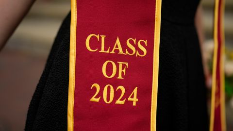 A recent graduate wears a garment with their graduation year on the University of Southern California campus Thursday, April 25, 2024, in Los Angeles. The University of Southern California canceled its main graduation ceremony Thursday. College officials across the U.S. are worried the ongoing Israel-Hamas war protests could disrupt plans for commencement ceremonies next month. (AP Photo/Jae C. Hong)