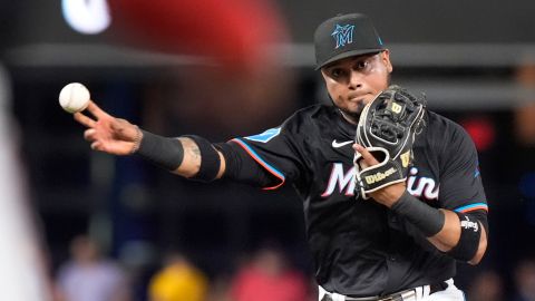 Miami Marlins second baseman Luis Arraez throws to first to put out Washington Nationals' Luis Garcia Jr. during the fourth inning of a baseball game, Friday, April 26, 2024, in Miami. (AP Photo/Wilfredo Lee)