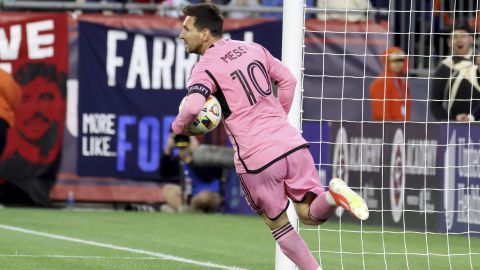 Inter Miami forward Lionel Messi (10) retrieves the ball from the net after scoring in the first half of an MLS soccer match against the New England Revolution, Saturday, April 27, 2024, in Foxborough, Mass. (AP Photo/Mark Stockwell)