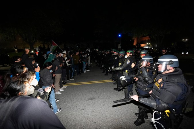 Police advance on demonstrators on the UCLA campus Thursday, May 2, 2024, in Los Angeles. (AP Photo/Ryan Sun)