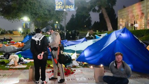 Pro-Palestinian demonstrators are detained on the UCLA campus Thursday, May 2, 2024, in Los Angeles. (AP Photo/Jae C. Hong)