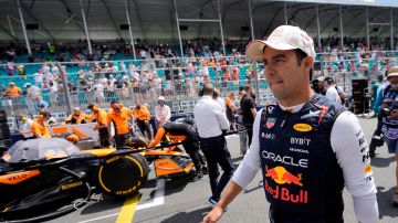 Red Bull driver Sergio Perez, of Mexico, walks along the grid before the Sprint race at the Miami Formula One Grand Prix, Saturday, May 4, 2024, in Miami Gardens, Fla. (AP Photo/Lynne Sladky)