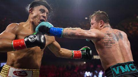 Canelo Alvarez hits Jaime Munguia in a super middleweight title fight Saturday, May 4, 2024, in Las Vegas. (AP Photo/John Locher)