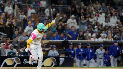 San Diego Padres' Luis Arraez watches his walkoff single during the ninth inning of a baseball game against the Los Angeles Dodgers, Friday, May 10, 2024, in San Diego. The Padres won, 2-1. (AP Photo/Gregory Bull)