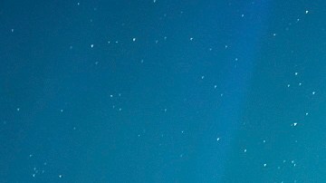 This photo provided by the Ministry of Water, Land and Resource Stewardship shows a wildfire, Aurora Borealis overhead, near Fort Nelson, British Columbia Saturday, May 11, 2024. An intense wildfire could hit a town in western Canada on Monday, based on forecasts of strong winds that have been fueling the out-of-control blaze which has already forced the evacuation of thousands, fire experts and officials warned. (Ministry of Water, Land and Resource Stewardship/The Canadian Press via AP)