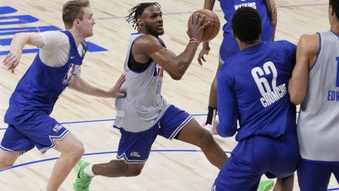 Bronny James (50), second from left, drives to the basket past Cam Spencer, left, during the 2024 NBA basketball Draft Combine in Chicago, Tuesday, May 14, 2024. (AP Photo/Nam Y. Huh)