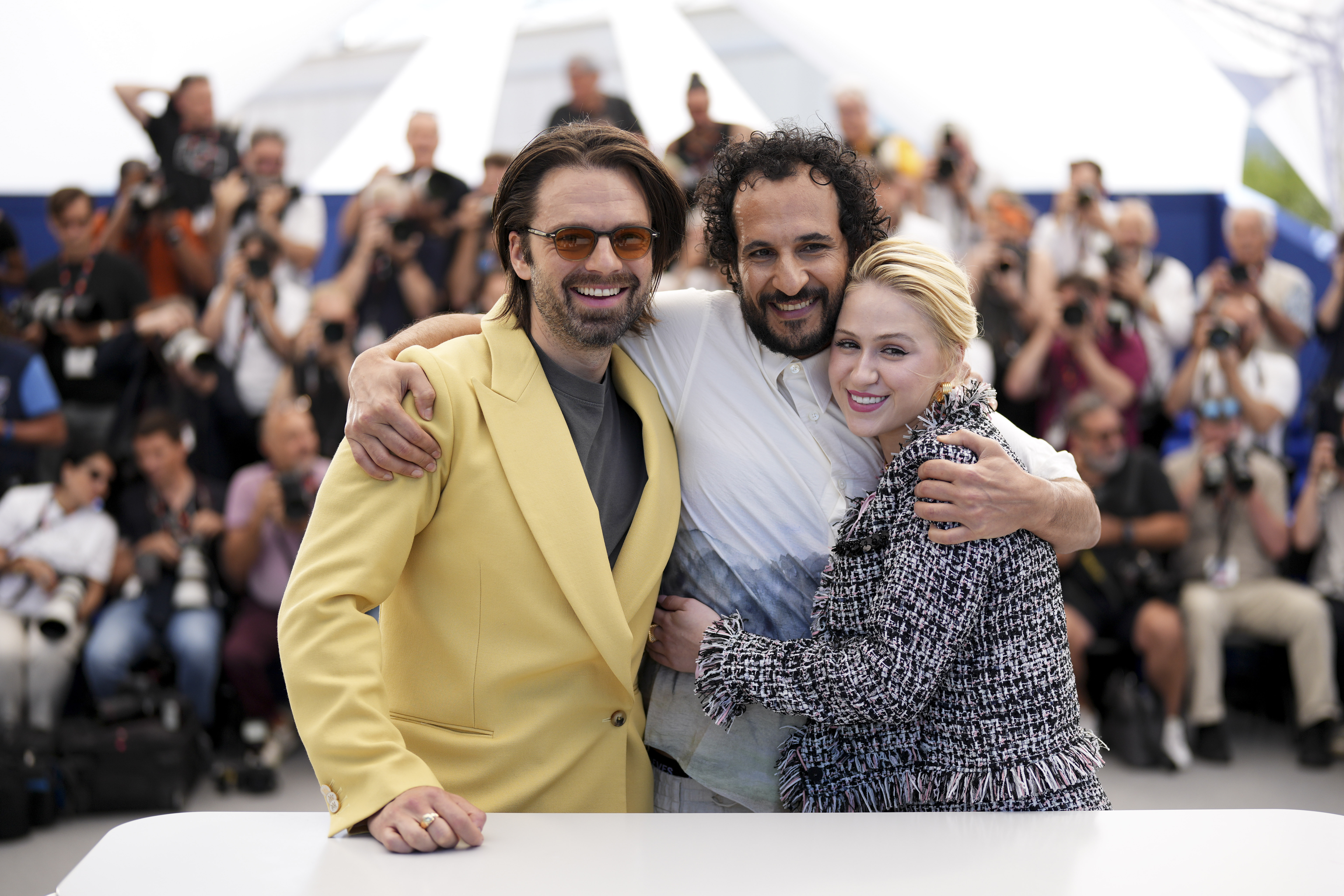 Sebastian Stan, from left, director Ali Abbasi, and Maria Bakalova pose for photographers at the photo call for the film 'The Apprentice' at the 77th international film festival, Cannes, southern France, Tuesday, May 21, 2024. (Photo by Scott A Garfitt/Invision/AP)