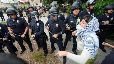 Police officers face off against pro-Palestinian protesters on the campus of UCLA on Thursday, May 23, 2024, In Los Angeles. (AP Photo/Damian Dovarganes)