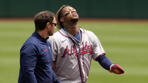 Atlanta Braves' Ronald Acuña Jr., right, walks off the field with a trainer after being injured while running the bases during the first inning of a baseball game against the Pittsburgh Pirates in Pittsburgh, Sunday, May 26, 2024. (AP Photo/Gene J. Puskar)