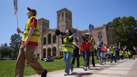 UCLA workers, students and supporters picket at Royce Quad in the University of California, Los Angeles, UCLA campus Tuesday, May, 28, 2024, The UAW union representing student workers of the University of California have escalated a labor standoff to include three campuses. (AP Photo/Damian Dovarganes)