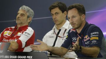 From left, Ferrari team principal Maurizio Arrivabene, flanked by Mercedes team principal Toto Wolff and Red Bull team principal Christian Horner attend a news conference at the Yas Marina racetrack in Abu Dhabi, United Arab Emirates, Friday, Nov. 27, 2015. The Emirates Formula One Grand Prix will take place on Sunday. (AP Photo/Luca Bruno)