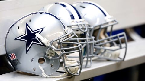 Dallas Cowboys helmets sit on the bench during the first half of an NFL football game against the New Orleans Saints Sunday, Dec. 23, 2012 in Arlington, Texas. (AP Photo/Sharon Ellman)