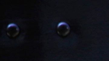 In this June 20, 2014 photo, the United Parcel Service logo is seen on the side of a truck as driver Marty Thompson is reflected returning from a delivery in Cumming, Ga. (AP Photo/David Goldman)