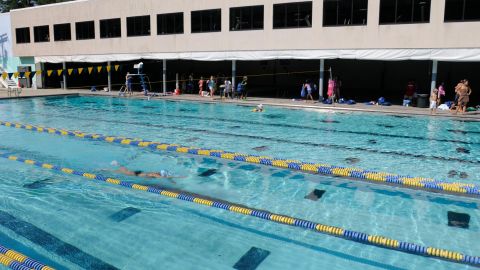 Swimmers work out Tuesday, August 19, 2008 at Meadowbrook Aquatic Center in Baltimore. Olympic swimmer Michael Phelps, who considers the club his home pool, will likely be involved in the business operations of the Baltimore-area swim club and its facilities, although nothing is finalized. (AP Photo/Steve Ruark)