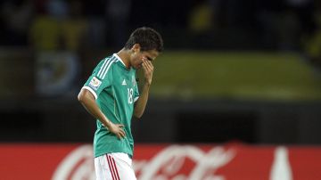 Mexico's Ulises Davila leaves the field after a U-20 World Cup semifinal against Brazil in Pereira, Colombia, Wednesday, Aug. 17, 2011. Brazil will play the final against Portugal after defeating Mexico 2-0.(AP Photo/Ricardo Mazalan)