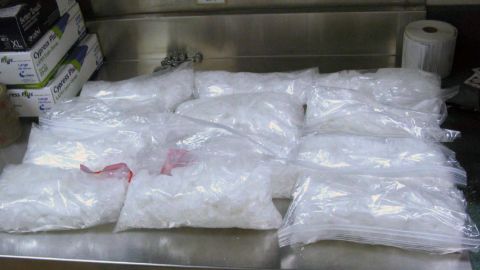 This undated photo provided by the U.S. Border Patrol shows 12 packages of methamphetamine that were confiscated from a U.S. citizen after a border patrol agent spotted a remote-controlled drone swooping over the border fence Tuesday, Aug. 8, 2017 at a border crossing near San Diego, Calif. Authorities have arrested a man they say used the drone to fly drugs across the Mexican border into California. (U.S. Border Patrol via AP)