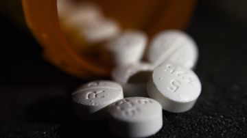 This Tuesday, Aug. 15, 2017 photo shows an arrangement of pills of the opioid oxycodone-acetaminophen in New York. Abuse of painkillers, heroin, fentanyl and other opioids across the country has resulted in tens of thousands of children being taken from their homes and placed in the foster care system. (AP Photo/Patrick Sison)