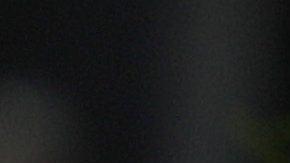 A Ferrari team crew member drives a forklift past a poster of the seven-time F1 champion Michael Schumacher of Germany on display at the paddock of the Shanghai International Circuit ahead of the Chinese Formula One Grand Prix in Shanghai, China, Thursday, April 11, 2019. (AP Photo/Andy Wong)