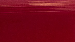 FILE - This Wednesday, Aug. 8, 2018, file photo shows the Tesla emblem on the back end of a Model S in the Tesla showroom in Santa Monica, Calif. Faced with a slumping stock price and questions about demand for its vehicles, Tesla has lowered the U.S. base prices of its two most expensive models. The company on Monday, May 21, 2019 cut $3,000 from the price of the Model S sedan and $2,000 from the Model X SUV. (AP Photo/Richard Vogel, File)