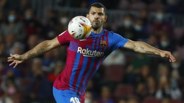 FILE - Barcelona's Sergio Aguero controls the ball during the Spanish La Liga soccer match between FC Barcelona and Valencia at the Camp Nou stadium in Barcelona, Spain, Oct. 17, 2021. Barcelona striker Sergio Aguero has on Wednesday, Dec. 15 announced his immediate retirement for health reasons. (AP Photo/Joan Monfort, file)