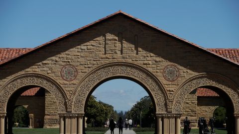 FILE - Pedestrians walk on the campus at Stanford University in Stanford, Calif., April 9, 2019. Stanford University said it found a noose hanging from a tree outside of a residence hall and is investigating the incident as a hate crime. In an email to students and staff, university officials said campus safety authorities immediately "removed the noose and retained it as evidence," after receiving a report late Sunday, May 8, 2022, that a noose was seen outside an undergraduate dormitory. (AP Photo/Jeff Chiu, File)