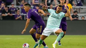 Orlando City midfielder Cesar Araujo (5) gets possession of the ball as he gets past Atlanta United forward Giorgos Giakoumakis, front right, during the first half of an MLS soccer match, Saturday, May 27, 2023, in Orlando, Fla. (AP Photo/John Raoux)