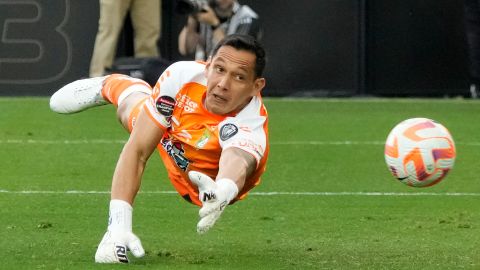 León goalkeeper Rodolfo Cota (30) deflects a shot on goal by Los Angeles FC during the first half in the second leg of a CONCACAF championship final soccer match, Sunday, June 4, 2023, in Los Angeles. (AP Photo/Marcio Jose Sanchez)