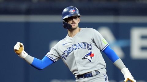 Toronto Blue Jays' Cavan Biggio celebrates his RBI double off Tampa Bay Rays relief pitcher Shawn Armstrong during the sixth inning of a baseball game Saturday, Sept. 23, 2023, in St. Petersburg, Fla. Blue Jays' Bo Bichette scored on the hit. (AP Photo/Chris O'Meara)