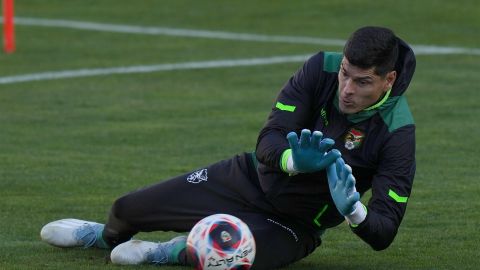 Bolivia's goalkeeper Carlos Lampe blocks the ball during a training session at the Hernando Siles stadium in La Paz, Bolivia, Tuesday, Oct. 10, 2023. Bolivia will face Ecuador in a World Cup 2026 qualifying soccer match in La Paz, on Oct. 12. (AP Photo/Juan Karita)