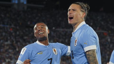 Uruguay's Nicolas De La Cruz, left, celebrates with teammate Darwin Nunez after scoring his side's 2nd goal against Brazil during a qualifying soccer match for the FIFA World Cup 2026 at Centenario stadium in Montevideo, Uruguay, Tuesday, Oct. 17, 2023. (AP Photo/Matilde Campodonico)