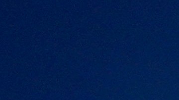 A youth cools off at the "Parque de Agua" public water park on a hot summer day in Santiago, Chile, Wednesday, Jan. 31, 2024. Dozens of public water parks like this are set up across the city during the summer to help residents cool off. (AP Photo/Esteban Felix)