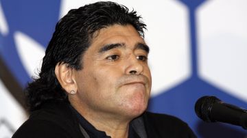 FILE - Argentina's national soccer team coach Diego Maradona attends a news conference in Caracas, Venezuela, Tuesday, Jan. 27, 2009. A medical examiner's report into the death of Maradona injected uncertainty Monday, April 29, 2024, into a case of criminal negligence brought against eight medical workers involved in his care, raising new questions just a month before the staffers are set to stand trial for homicide. (AP Photo/Carlos Hernandez, File)