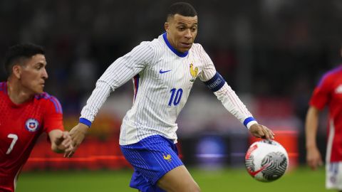 FILE - France's Kylian Mbappe goes for the ball during an international friendly soccer match between France and Chile at the Orange Velodrome stadium in Marseille, southern France, Tuesday, March 26, 2024. France boasts one of the European Championship’s strongest attacks but it could be offset by a vulnerable defense and a dearth of leadership. While France looks solid in midfield and has Kylian Mbappé with Antoine Griezmann in attack, the defense could be a weak point. (AP Photo/Daniel Cole, File)