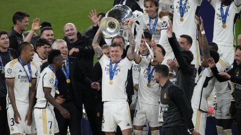 Real Madrid's Toni Kroos lifts the trophy after the Champions League final soccer match between Borussia Dortmund and Real Madrid at Wembley stadium in London, Saturday, June 1, 2024. Real Madrid won 2-0. (AP Photo/Dave Shopland)