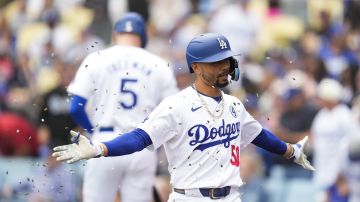 Los Angeles Dodgers' Mookie Betts (50) celebrates after hitting a home run during the first inning of a baseball game against the Colorado Rockies in Los Angeles, Sunday, June 2, 2024. (AP Photo/Ashley Landis)