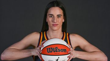 FILE - Indiana Fever guard Caitlin Clark (22) poses during WNBA basketball team's media day in Indianapolis, Wednesday, May 1, 2024. (AP Photo/Michael Conroy, File)