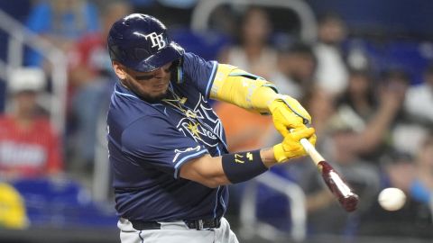 Tampa Bay Rays' Isaac Paredes hits a RBI double to score Randy Arozarena and Brandon Lowe during the first inning of a baseball game against the Miami Marlins, Wednesday, June 5, 2024, in Miami. (AP Photo/Lynne Sladky)