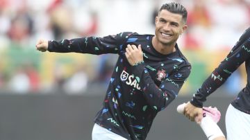 Portugal's Cristiano Ronaldo warms up02 prior to the start of an international friendly soccer match between Portugal and Croatia at the National Stadium in Oeiras, outside Lisbon, Saturday, June 8, 2024. (AP Photo/Pedro Rocha)