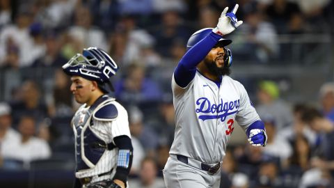 Los Angeles Dodgers' Teoscar Hernández reacts after hitting a home run against the New York Yankees during the sixth inning of a baseball game, Sunday, June 9, 2024, in New York. (AP Photo/Noah K. Murray)