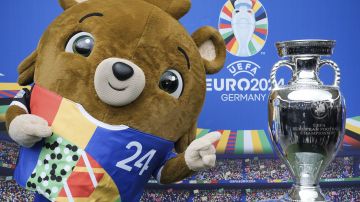 FILE - Tournament mascot 'Albaert' poses for the media during the presentation of the European soccer championship 'EURO 2024' trophy at the Olympic Stadium in Berlin, Germany, Wednesday, April 24, 2024. The Euros kick off in Munich, Friday June 14, when host country Germany plays Scotland at Bayern Munich's Allianz Arena. The tournament begins with six groups of four teams. (AP Photo/Markus Schreiber, File)