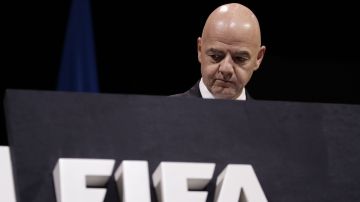 FILE - FIFA President Gianni Infantino walks on the stage before the start of the 69th FIFA congress in Paris, Wednesday, June 5, 2019. FIFA was facing more opposition to its newly-expanded Club World Cup in America on Thursday, June 13, 2024 after World players’ union FIFPRO said a legal claim had been submitted against the decision to create the tournament. (AP Photo/Alessandra Tarantino, File)