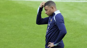 France's Kylian Mbappe gestures during a training session in Paderborn, Germany, Thursday, June 13, 2024. Mbappé was absent when the squad took part in an open practice session at its European Championship base on Thursday. France will play against Austria during their Group D soccer match at the Euro 2024 soccer tournament on June 17. (AP Photo/Hassan Ammar)