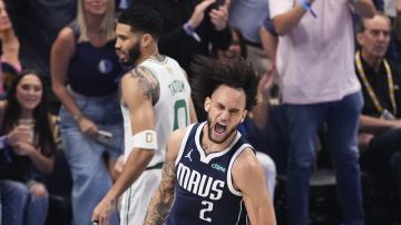 Dallas Mavericks center Dereck Lively II (2) celebrates after scoring against the Boston Celtics during the first half in Game 4 of the NBA basketball finals, Friday, June 14, 2024, in Dallas. (AP Photo/Sam Hodde)